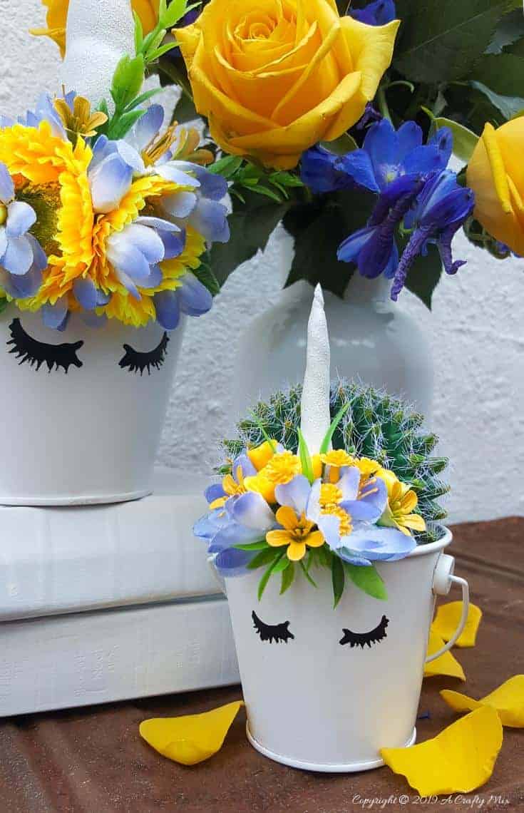 This cute unicorn bucket pencil holder is a lovely back to school gift idea. They can be used as small planters too and they're quick and easy to make using moldable plastic and some faux flowers. #backtoschool #unicorncrafts #pencilholder #DIYpencilholder #moldableplastic #instamorph #unicorn