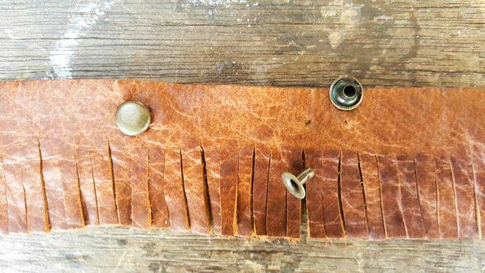 Adding a few studs to the leather fringe #tincan #recycle #repurpose #tincanrecycle #tincanplanter #acraftymix #creativetincanprojects #uniquetincanDIY