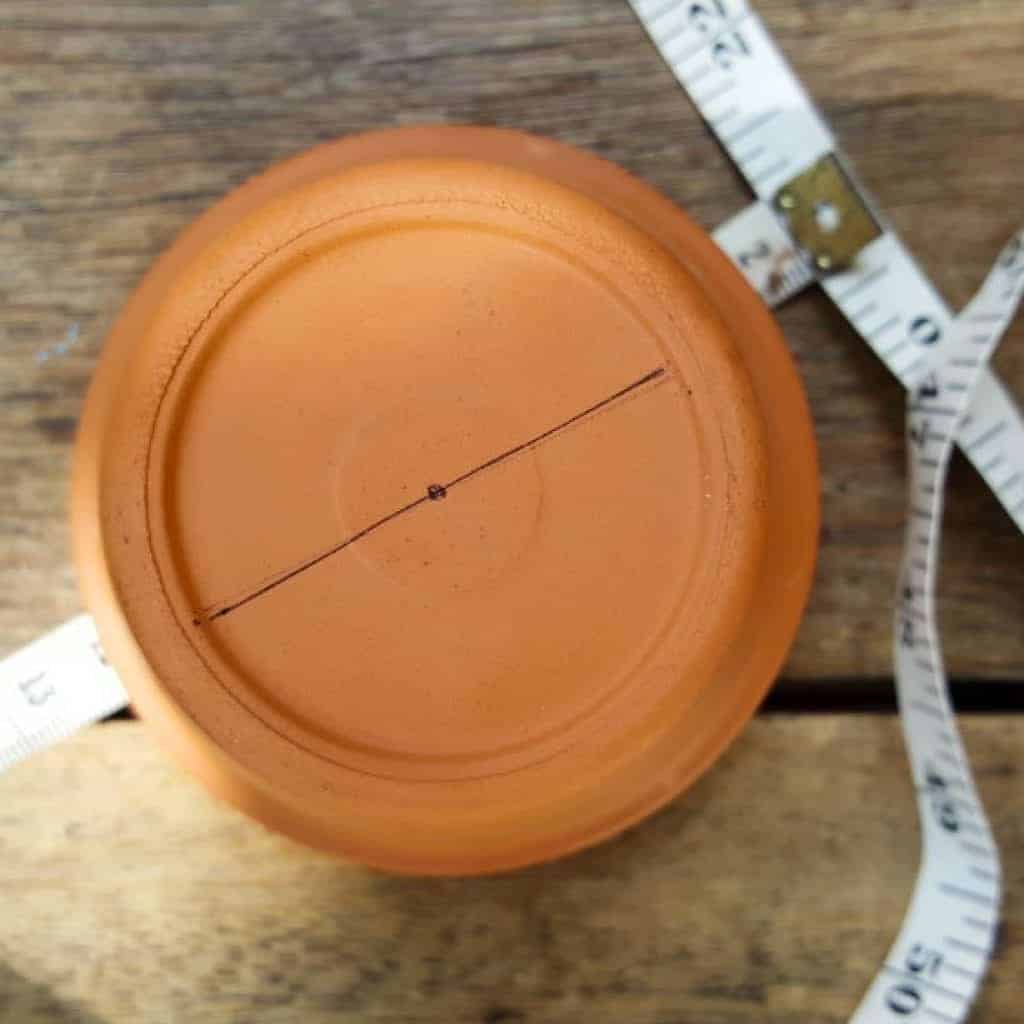 Mark where to cut #terracottapots #treeplanters #easycrafts #planterideas #terracottaplanters #acraftymix