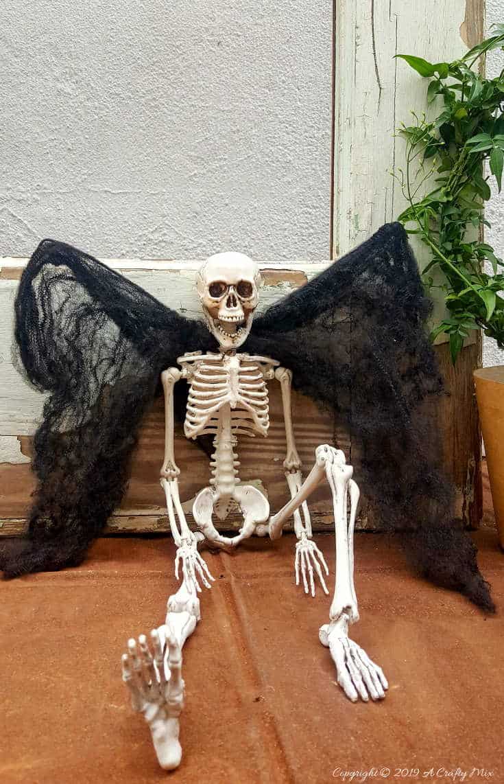 Sergeant Skullie with his vampire wings is just chillin' waiting for Halloween to come around. #ACraftyMix #FunHalloweenCraft #EasyHalloweenCraft #HalloweenDIY #HalloweenCraft #HolidayCraft