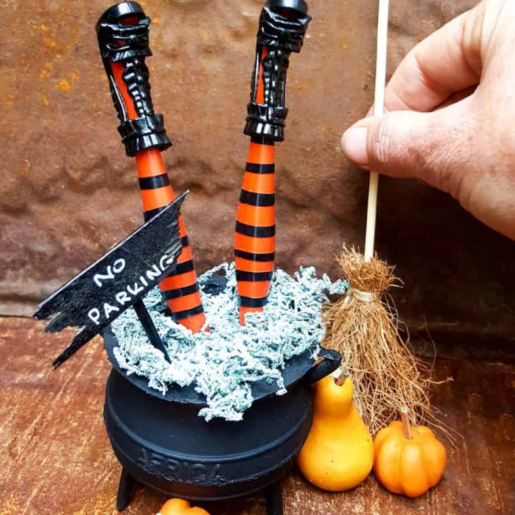 How to make wickedly wonderful miniature witch legs in a cauldron. Inspired by Grandin Road #Halloweendecor #dollmakeover #spidergirl #acraftymix #halloweentutorial #halloweenDIY #witchlegs #grandinroad #miniaturehalloween