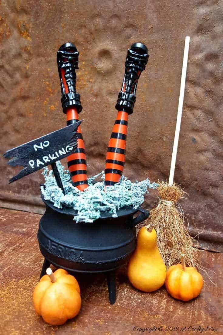 How to make wickedly wonderful miniature witch legs in a cauldron. Inspired by Grandin Road #Halloweendecor #dollmakeover #spidergirl #acraftymix #halloweentutorial #halloweenDIY #witchlegs #grandinroad #miniaturehalloween