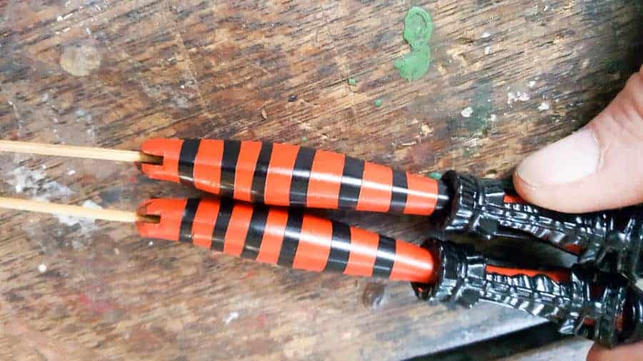 Glue a toothpick inside the legs to create a stake #Halloweendecor #dollmakeover #spidergirl #acraftymix #halloweentutorial #halloweenDIY #witchlegs #grandinroad #miniaturehalloween