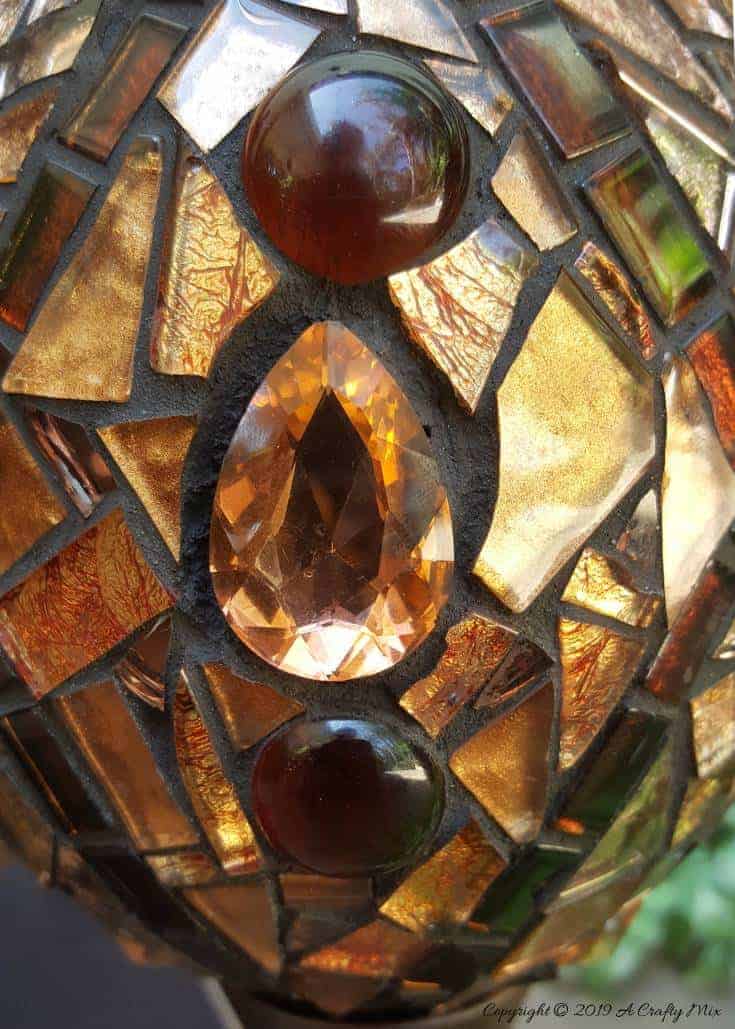 How to make a beautiful Faberge Mosaic Egg. Includes all the tips and tricks you need to know to mosaic on a curved surface #Mosaicart #FabergeMosaic #MosaicTips #acraftymix #Mosaictricks #MosaicDIY #MosaicHowTo #RussianEggs