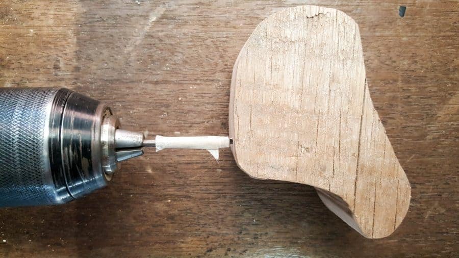 Drill four holes in the bottom of the shape #woodenreindeer #DIYReindeer #DIYRustyReindeer #RustyNailrepurpose #acraftymix # Reindeerdecor #reindeertemplate