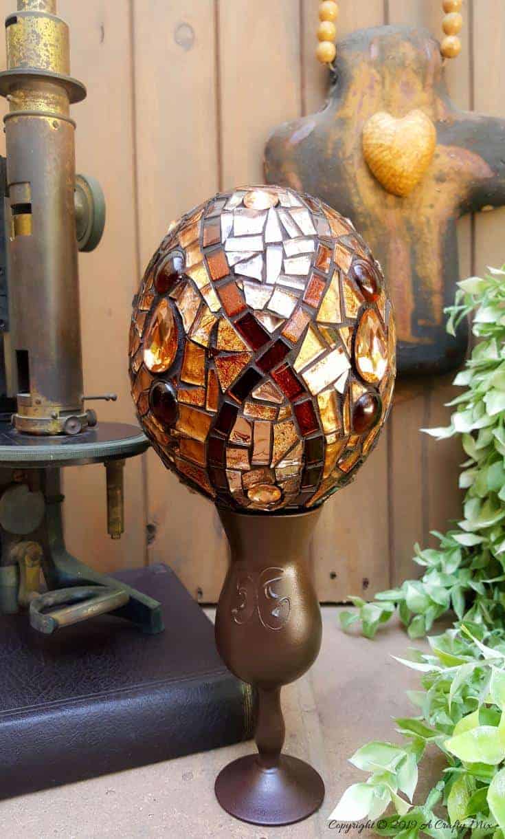How to make a beautiful Faberge Mosaic Egg. Includes all the tips and tricks you need to know to mosaic on a curved surface #Mosaicart #FabergeMosaic #MosaicTips #acraftymix #Mosaictricks #MosaicDIY #MosaicHowTo #RussianEggs