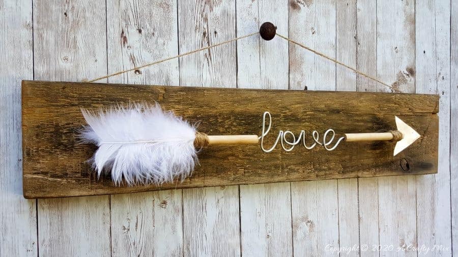 Make a gorgeous LOVE arrow sign to add to your gallery wall. It&rsquo;s fun, easy and you can customize the wire words to fit your unique style. Includes two free printables #gallerywall #acraftymix #valentinesday #lovearrow #bohodecor #lovedecor #DIYArrowdecor #ArrowPrintable #arrowDIY #arrowcrafts #DIYWirewords