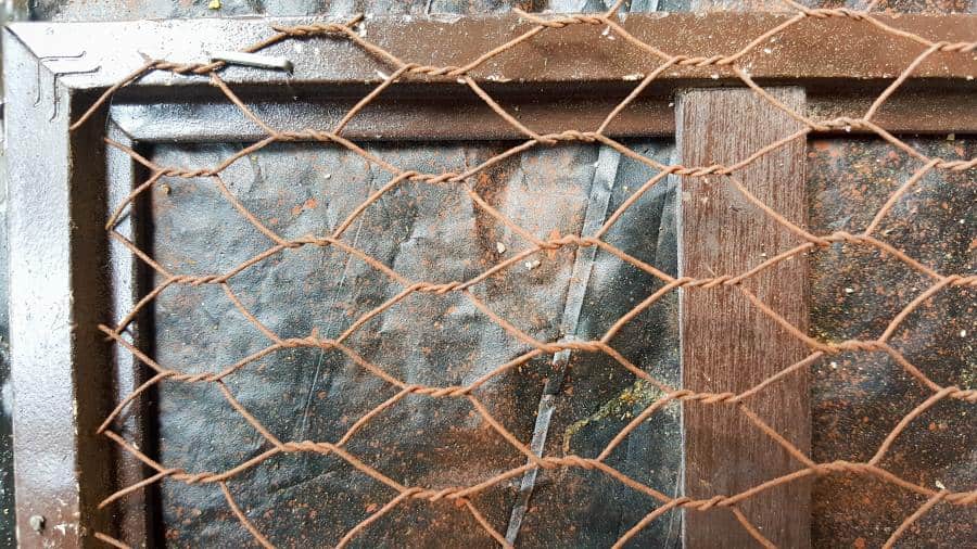 Staple the rusty chicken wire on the back of the rusted picture frames #UnicornSpitTechniques #Windowplanter #UnicornSpitRustEffect #FauxRustEffect #ACraftyMix #PictureFrameRepupose #UnicornSpitIdeas #PictureFrameCrafts #SpillingPlanter
