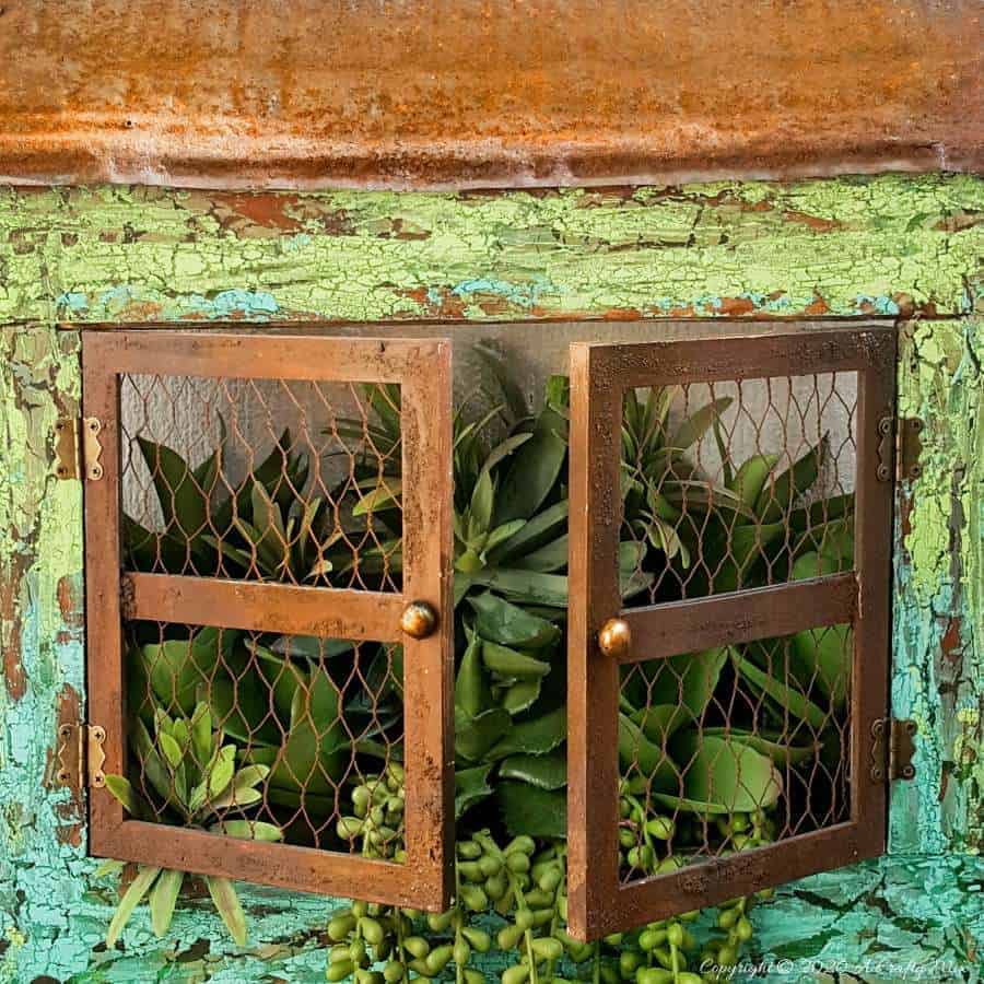 Full tutorial how to make this gorgeous "Cracked Up" Unicorn SPit planter with plastic picture frame windows. Includes how to get a rust effect with US #UnicornSpitTechniques #Windowplanter #UnicornSpitRustEffect #FauxRustEffect #ACraftyMix #PictureFrameRepupose #UnicornSpitIdeas #PictureFrameCrafts #SpillingPlanter