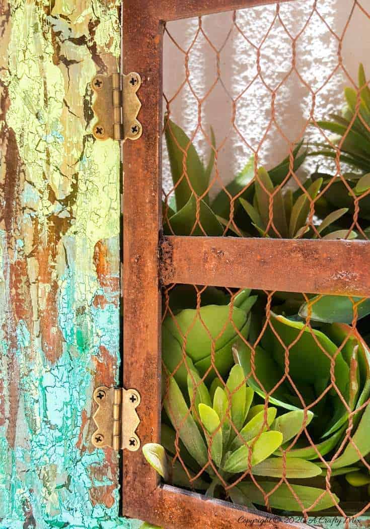 See how to create a rust effect with Unicorn SPiT. The step-by-step tutorial includes how to get the "Cracked Up" paint effect and make a spilling window planter #UnicornSpitTechniques #Windowplanter #UnicornSpitRustEffect #FauxRustEffect #ACraftyMix #PictureFrameRepupose #UnicornSpitIdeas #PictureFrameCrafts #SpillingPlanter
