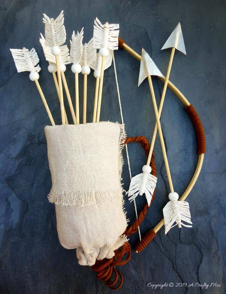 Make this no-sew quiver full of macram&eacute; arrows for Valentine&rsquo;s Day using empty soda cans. It&rsquo;s a fun gift idea and you can use it all year round in your home d&eacute;cor too. It only take an hour to make and you don&rsquo;t need any fancy tools or equipment either. #VintageValentine #TinCanRecycle #ValentineGiftIdea #QuiverArrows #AcraftyMix #HomeDecor #MacrameArrow