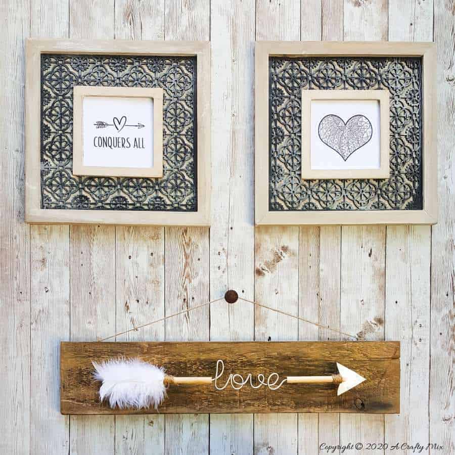 Make a gorgeous LOVE arrow sign to add to your gallery wall. It&rsquo;s fun, easy and you can customize the wire words to fit your unique style. #gallerywall #acraftymix #valentinesday #lovearrow #bohodecor #lovedecor #DIYArrowdecor #ArrowPrintable #arrowDIY #arrowcrafts #DIYWirewords