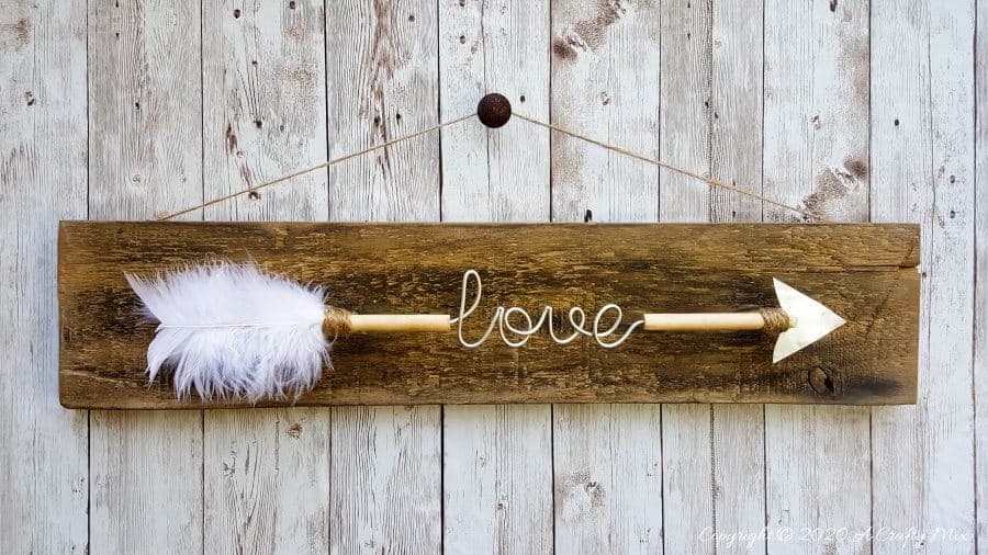 Make a gorgeous LOVE arrow sign to add to your gallery wall. It&rsquo;s fun, easy and you can customize the wire words to fit your unique style. #gallerywall #acraftymix #valentinesday #lovearrow #bohodecor #lovedecor #DIYArrowdecor #ArrowPrintable #arrowDIY #arrowcrafts #DIYWirewords