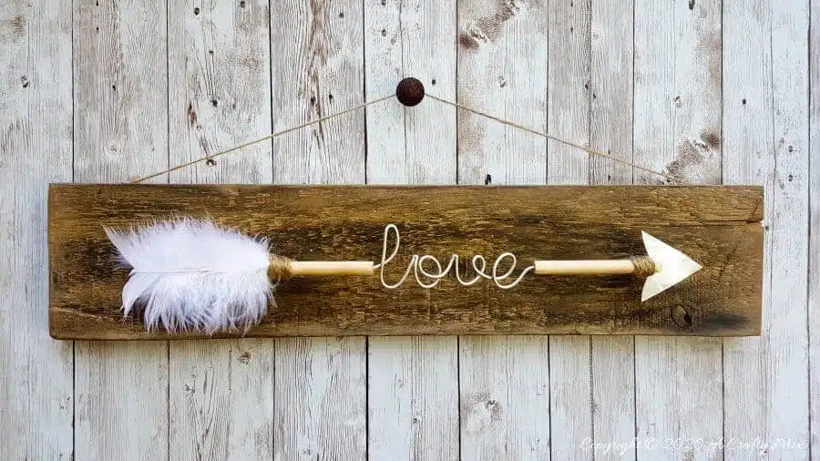 Make a gorgeous LOVE arrow sign to add to your gallery wall. It’s fun, easy and you can customize the wire words to fit your unique style. #gallerywall #acraftymix #valentinesday #lovearrow #bohodecor #lovedecor #DIYArrowdecor #ArrowPrintable #arrowDIY #arrowcrafts #DIYWirewords
