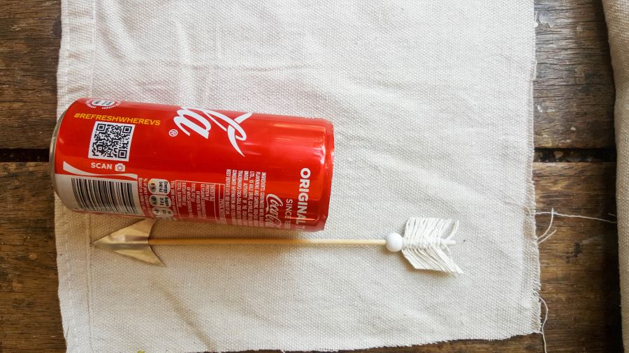 Use the empty soda can to estimate how much of the drop cloth should be cut #VintageValentine #TinCanRecycle #ValentineGiftIdea #QuiverArrows #AcraftyMix #HomeDecor #MacrameArrow