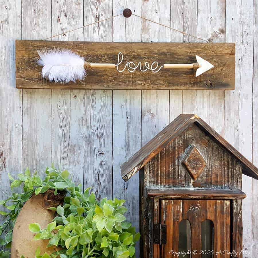 Make a gorgeous LOVE arrow sign to add to your gallery wall. It&rsquo;s fun, easy and you can customize the wire words to fit your unique style. #gallerywall #acraftymix #valentinesday #lovearrow #bohodecor #lovedecor #DIYArrowdecor #ArrowPrintable #arrowDIY #arrowcrafts #DIYWirewords