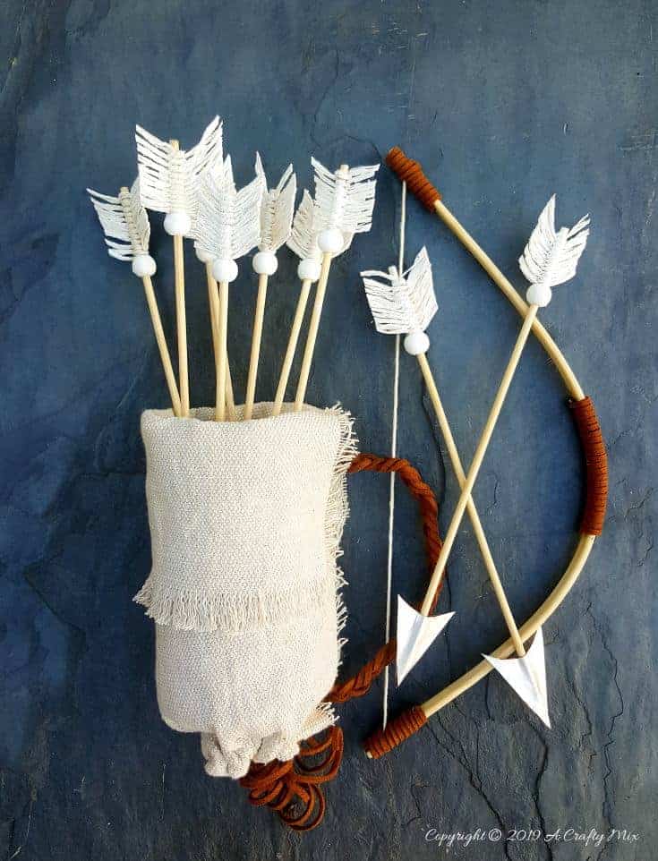 Make this no-sew quiver full of macramé arrows for Valentine’s Day using empty soda cans. It’s a fun gift idea and you can use it all year round in your home décor too. It only take an hour to make and you don’t need any fancy tools or equipment either. #VintageValentine #TinCanRecycle #ValentineGiftIdea #QuiverArrows #AcraftyMix #HomeDecor #MacrameArrow
