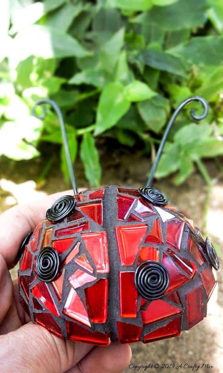 Ladybird, ladybird fly away home :-) How to use a rubber ball to make a 3D ladybug mosaic. Beautifully detailed tutorial. #LadyBugcrafts #LadyBugIdeas #LadyBugDIY #ACraftyMix #Ladybugmosaic #LadyBird #LadyBugCrafts #LadyBirdCrafts