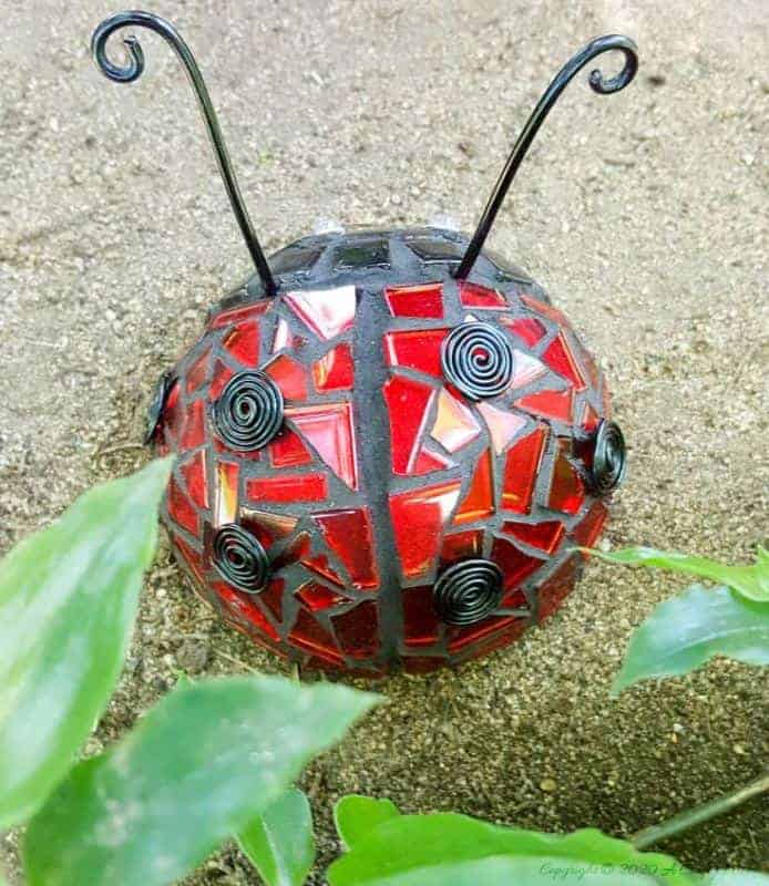 Ladybird, ladybird fly away home :-) How to use a rubber ball to make a 3D ladybug mosaic. Beautifully detailed tutorial. #LadyBugcrafts #LadyBugIdeas #LadyBugDIY #ACraftyMix #Ladybugmosaic #LadyBird #LadyBugCrafts #LadyBirdCrafts