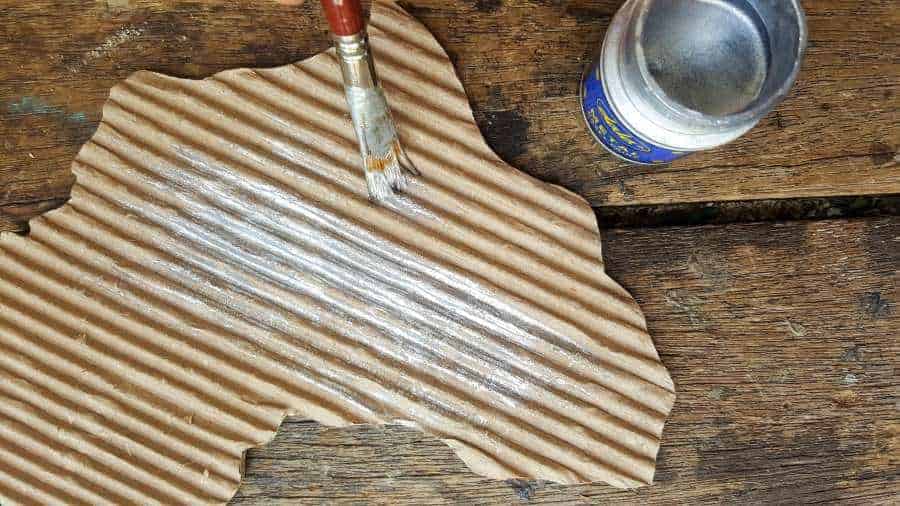 Paint the cardboard a metallic silver. #mixedmedia #mixedmediatutorial #DIYNightLight #ACraftyMix #fauxrust #Africa #HomeDecor #wireheart