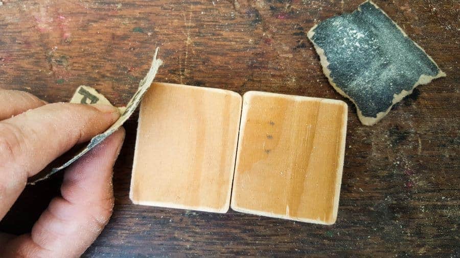 Sand the blocks of wood to get rid of any splinters. #FairygardenDIY #FairyFurniture #RustyNailFurniture #ACraftyMix #FairyGardenTutorials #CeilingTileRepupose #FairyGardenIdeas