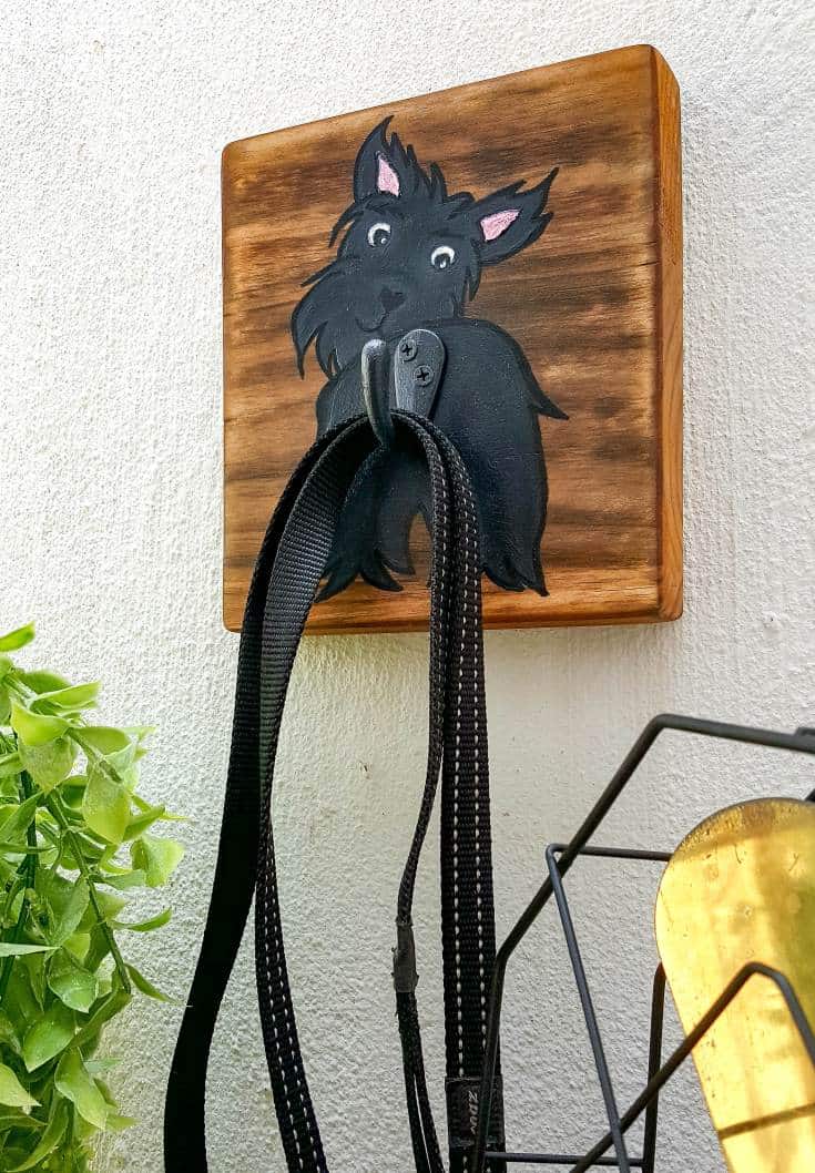 Make an adorable and easy DIY Dog Leash holder using a scrap piece of wood and craft paint. You and your fur baby will love it and the tutorial includes a free printable! #DIYDogLeash #Leashholderideas #WoodLeashHolder #ACraftyMix #FreePrintable #ScottishTerrier #PetLeashHolder #DIYLeashHolder