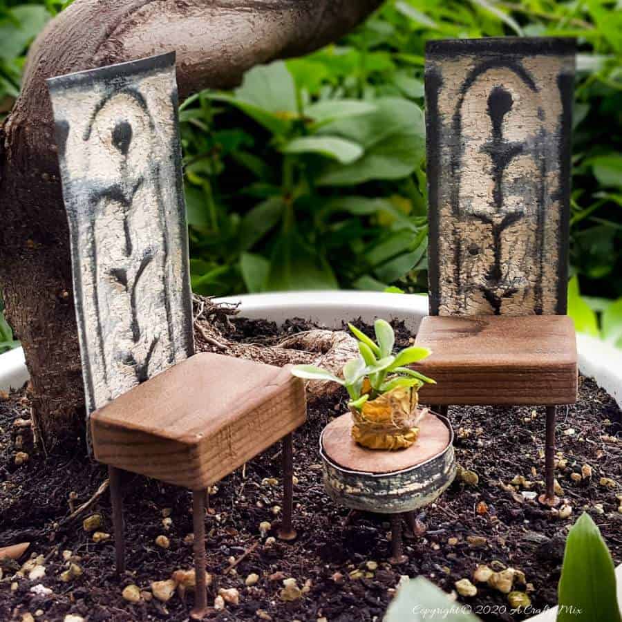 DIY Adorable fairy garden furniture using scraps of old rusty ceiling tiles and nails. #FairygardenDIY #FairyFurniture #RustyNailFurniture #ACraftyMix #FairyGardenTutorials #CeilingTileRepupose #FairyGardenIdeas