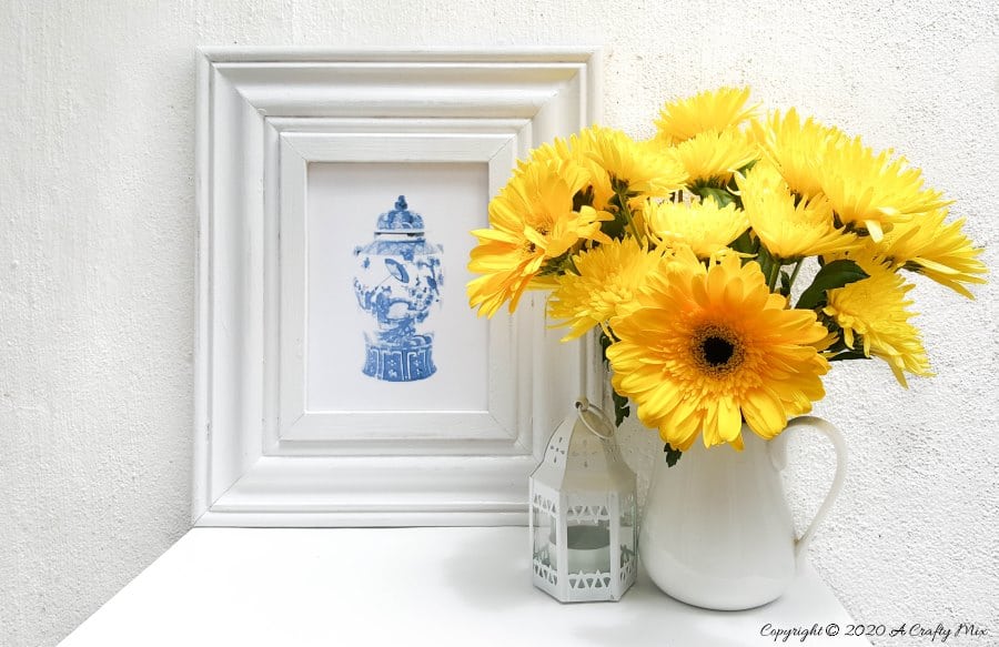 A gorgeous Chinioserie printable to compliment the finished look #ChinoiserieDecor #VinylTile #EasyMakeOver #HomeDecorDIY #chinoiserietiles #ACraftyMix #blueandwhitedecor #chinoiseriechic #VinylTileDecor #DIYTutorial