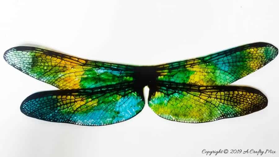 Cut the wings out #DragonflyWingsTempalte #DragonflyWingsDIY #ButterflyWings #ACraftyMix #DIYDragonfltWings #AlcoholInkCrafts #AlcoholInk #CraftTutorial