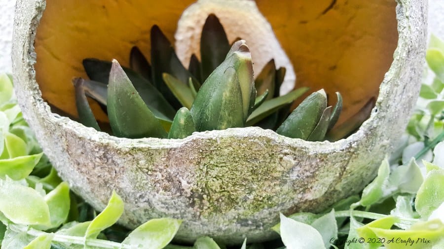 Are you looking for an awesome Easter craft idea? Would you like to know how to make a giant concrete Easter egg to add to your home decor?! This tutorial will show you how to make one using things you can find in any craft store and you won't have to mix any concrete to get the effect either. #EasterEgg #GiantEgg #DIYConcreteEgg #ACraftyMix #FauxConcreteEgg #EasterCrafts #EasterEggCrafts