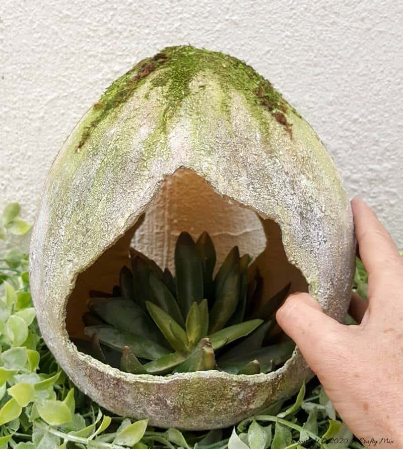 Are you looking for an awesome Easter craft idea? Would you like to know how to make a giant concrete Easter egg to add to your home decor?! This tutorial will show you how to make one using things you can find in any craft store and you won't have to mix any concrete to get the effect either. #EasterEgg #GiantEgg #DIYConcreteEgg #ACraftyMix #FauxConcreteEgg #EasterCrafts #EasterEggCrafts #EasterDecor