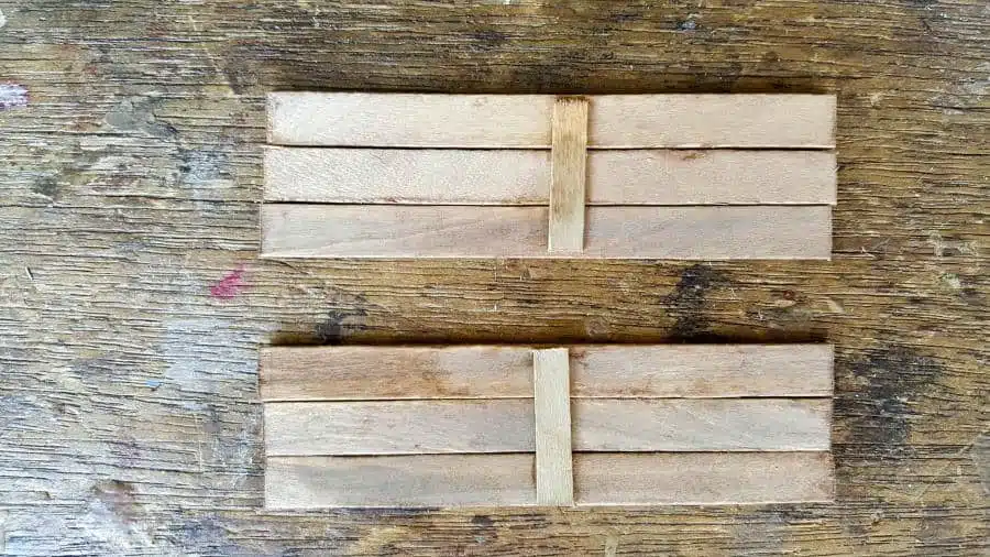 Cut the stirrers to the right lenght and glue together #FairyPottingBench #FairyDIYCrafts #ACraftyMix #FairyGardens #FairyCrafts #WhimsicalFairyCrafts #SimpleFairyCrafts #MiniaturePottingBench #RustyNails
