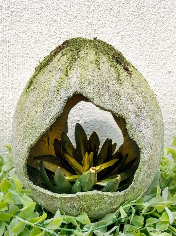 Are you looking for an awesome Easter craft idea? Would you like to know how to make a giant concrete Easter egg to add to your home decor?! This tutorial will show you how to make one using things you can find in any craft store and you won't have to mix any concrete to get the effect either. #EasterEgg #GiantEgg #DIYConcreteEgg #ACraftyMix #FauxConcreteEgg #EasterCrafts #EasterEggCrafts