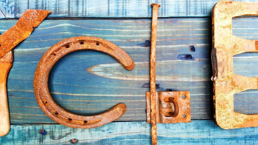 Arrange the rusty scrap metal letters on your board #Upcycling #Benefits #UpcycleSign #ACraftyMix #RepurposedLetters #RustyAlphabet #UpcycleStrong #InThisTogether #UpcyclingIdeas