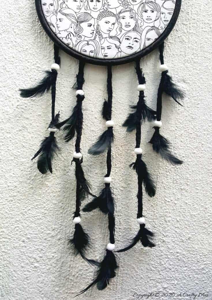 How to make a gorgeous paper napkin dream catcher. Easy craft idea to add to your home decor #DreamcatcherDIY #Napkinrepurpose #ACraftyMix #InThisTogether #BlackandWhite #HomeDecor #DreamcatcherCraft #TransferAdhesive #PaperNapkinCraft