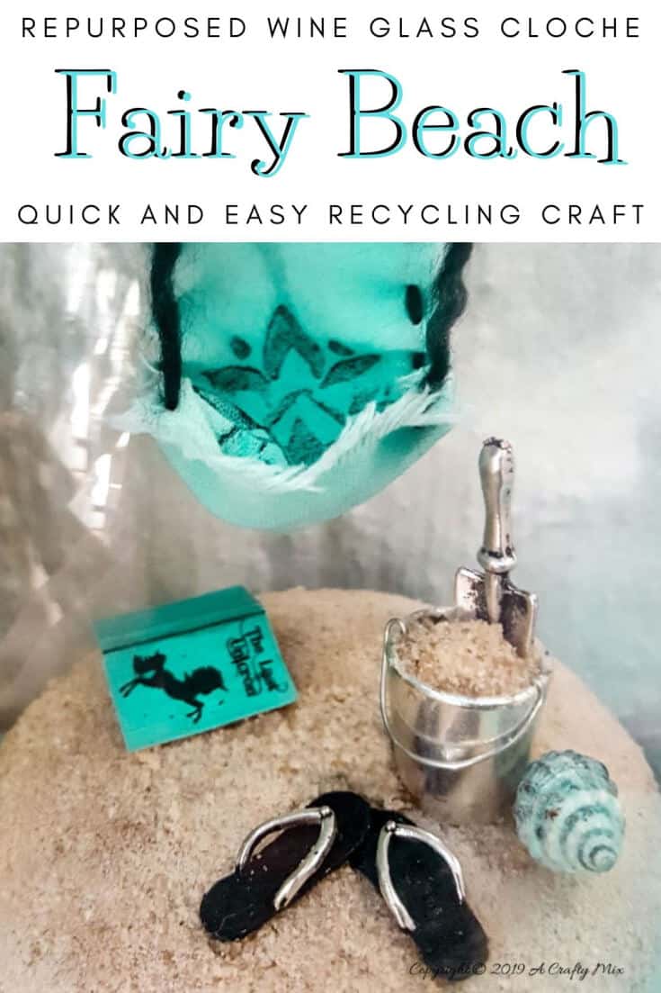 How to recycle a broken wine glass and make a fairy beach in a cloche #FairyGarden #FairyGardenIdeas #ACraftyMix #FairyGardenDIY #FairyBeachDIY #FairyGardenDesigns #ClocheDecor #ClocheIdeas #WineGlassCloche #ClocheDIY #WineGlassRepurpose #UnicornSPiT