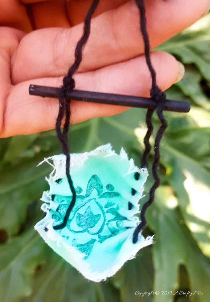 A fairy hammock dyed with Zia Teal Unicorn SPiT #FairyGarden #FairyGardenIdeas #ACraftyMix #FairyGardenDIY #FairyBeachDIY #FairyGardenIdeas #ClocheDecor #ClocheIdeas #WineGlassCloche #ClocheDIY #WineGlassRepurpose #UnicornSPiT