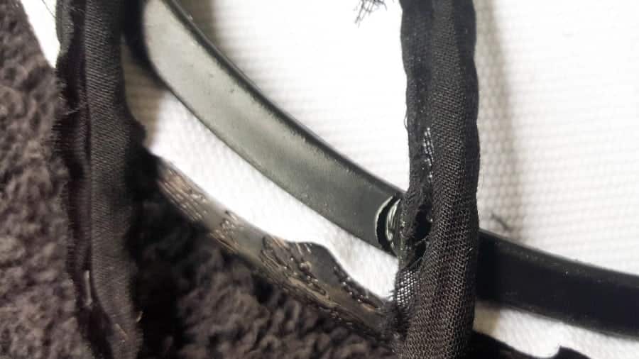 Glue the fabric strips to the back of the embroidery hoop #DreamcatcherDIY #Napkinrepurpose #ACraftyMix #InThisTogether #BlackandWhite #HomeDecor #DreamcatcherCraft #TransferAdhesive #PaperNapkinCraft