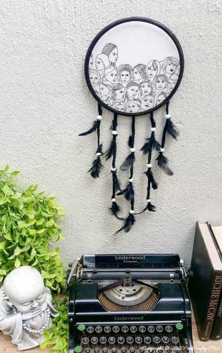 How to make a gorgeous paper napkin dream catcher. Easy craft idea to add to your home decor #DreamcatcherDIY #Napkinrepurpose #ACraftyMix #InThisTogether #BlackandWhite #HomeDecor #DreamcatcherCraft #TransferAdhesive #PaperNapkinCraft