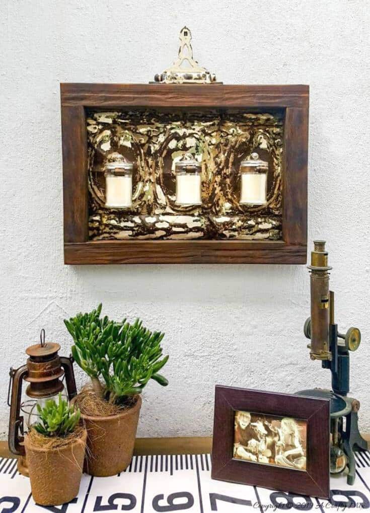 With Spring around the corner, it’s time to start getting those outdoor spaces ready. Find out how we transformed a tin ceiling tile into this gorgeous candle holder and how you can change it into a planter with one small twist. #farmhousedecor #rusticdecor #acraftymix #farmstyledecor #springproject #diyhomedecor #ceilingtilerepurpose