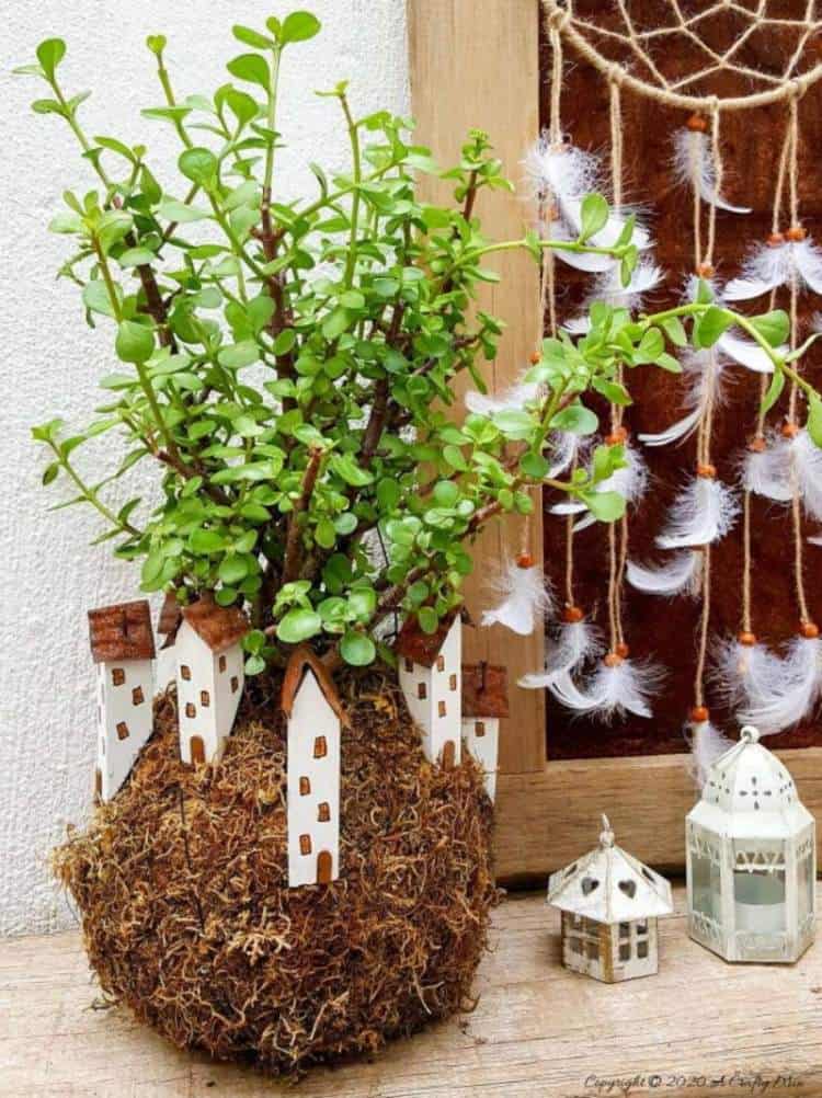 Take your moss ball string garden to the next level with this cute kokedama fairy village. Easy to make and customize. #EcoFriendly #Kokedama #FairyVillage #ACraftyMix #EasyGardenCraft #MossBalls #SpekBoom #kokedamaIdeas #StringGarden #IndoorPlants