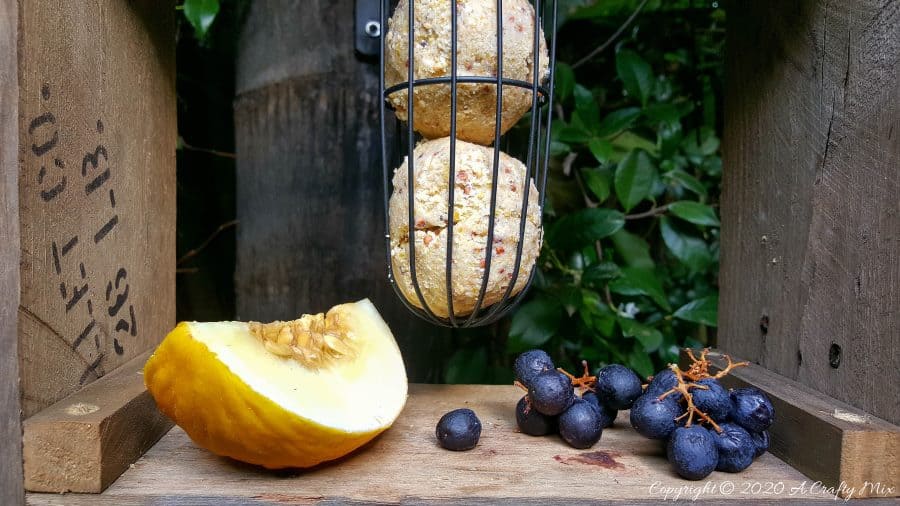 A DIY bird feeder is a great way to make your feathered friends feel at home and look after them when food sources are scarce. This rustic two tier bird feeder is quick to put together and the tiers make it easy to serve them a smorgasbord of treats too. #DIYBirdFeeder #RecycledBirdFeeder #RusticBirdFeeder #aCraftyMix #Woodenbirdfeeder #PalletBirdFeeder #UniqueBirdFeeder