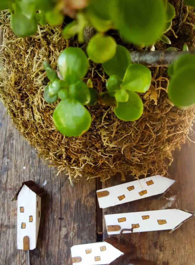 Insert the fairy buildings in the moss ball. #EcoFriendly #Kokedama #FairyVillage #ACraftyMix #EasyGardenCraft #MossBalls #SpekBoom #kokedamaIdeas #StringGarden #IndoorPlants