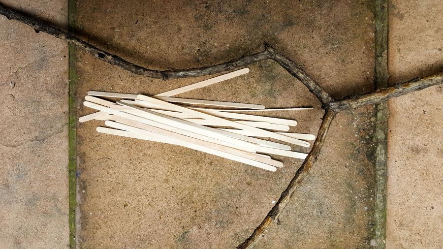 You'll need popsicle sticks, a branch, craft paint to make the fairy door #FairydoorDIY #FairyDoorIdeas #ACraftyMix #MakeAFairyDoor #MiniatureStainedGlass #AlcoholInk