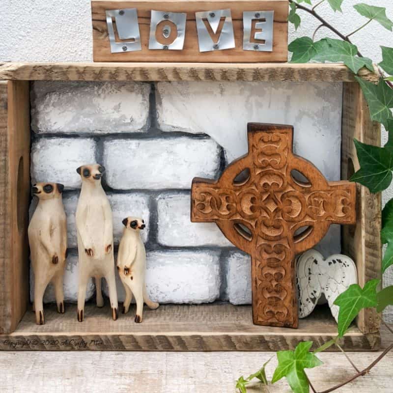 Take the traditional shadow box to a whole new level by adding faux bricks. This easy DIY tutorial will show you how to make your own shadow box in any size along with creating the faux bricks. #FauxBricksDIY #DisplayBoxDIY #ACraftyMix #BrickWallDisplaybox #DIYHomeDecor #FramedBricks