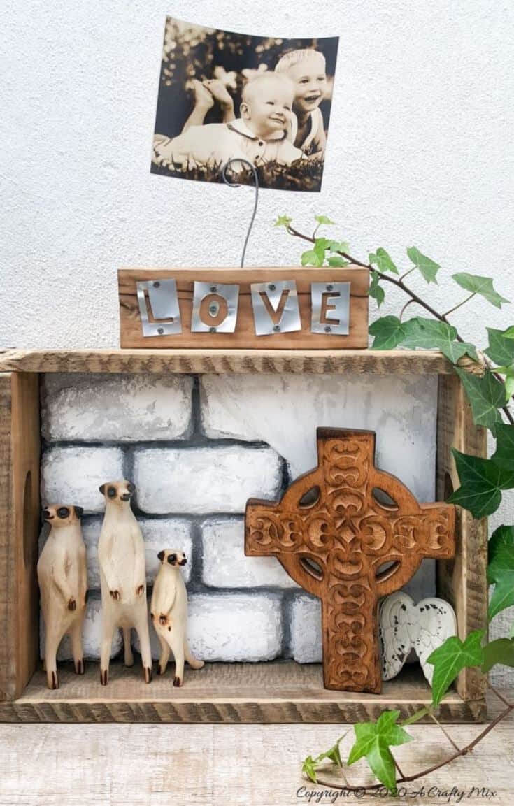 Take the traditional shadow box to a whole new level by adding faux bricks. This easy DIY tutorial will show you how to make your own shadow box in any size along with creating the faux bricks. #FauxBricksDIY #DisplayBoxDIY #ACraftyMix #BrickWallDisplaybox #DIYHomeDecor #FramedBricks