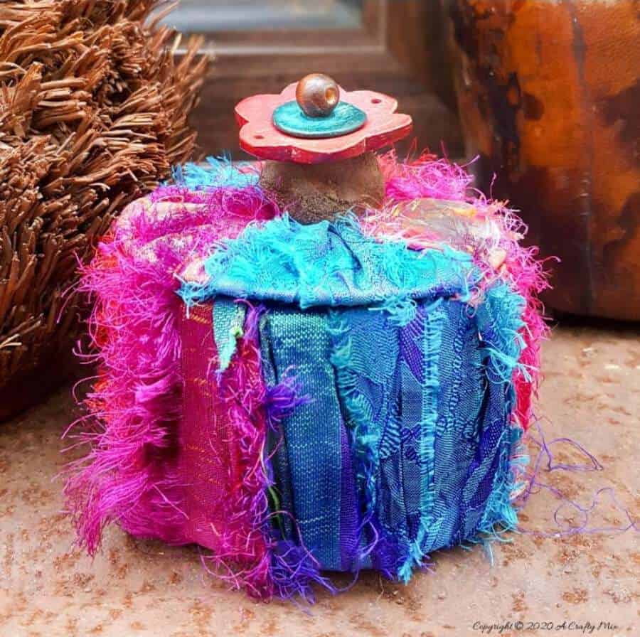 Don&rsquo;t throw that empty packing tape roll away until you&rsquo;ve seen how easy it is to turn it into this gorgeous boho storage box. #DuctTape #StorageIdeas #ACraftyMix #RepurposeIdeas #BohoDIYIdeas #RecycledStorage