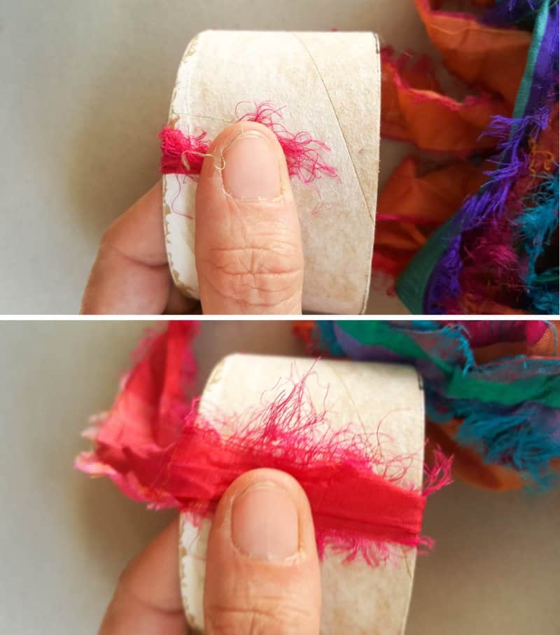Place the fabric scraps against the duct tape roll and start winding them around.