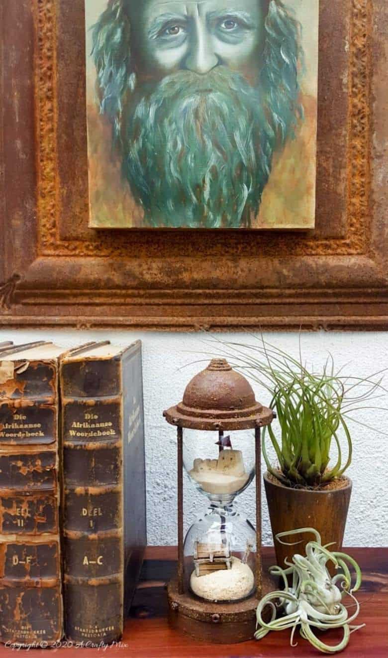 Turn broken wine glasses into this unique Sands of Time hourglass. The tutorial includes how to make miniature sandcastles and a tiny treasure chest. #wineglassrepurpose #SandsofTime #uniquedecor #acraftymix #hourglassdecor