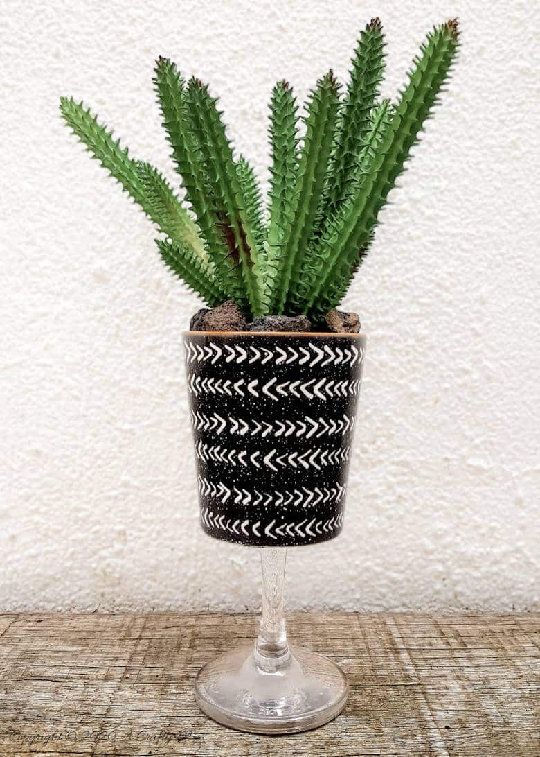 Turn trash into treasure and add a touch of class and whimsy to your d&eacute;cor with these gorgeous DIY broken wine glass stem planters. Easy to follow tutorial with step-by-step instructions